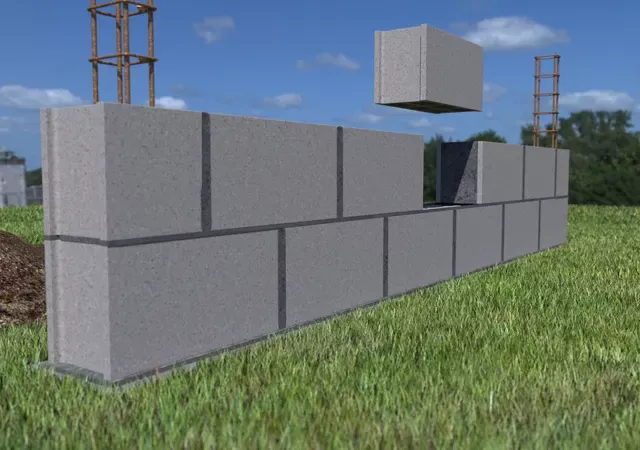 Construction d'un muret de clôture - Poser seconde rangée de parpaings